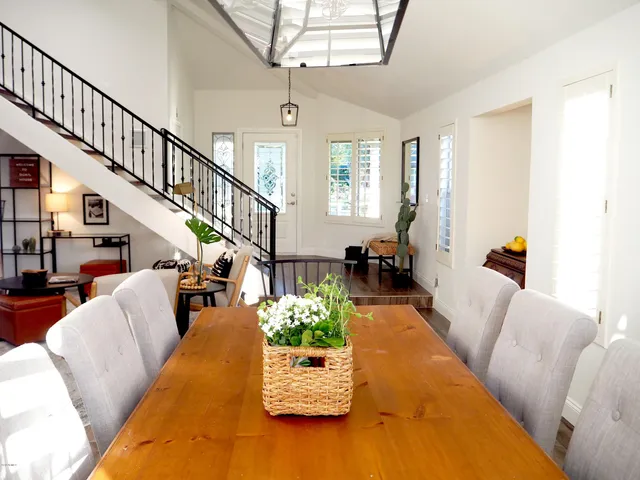 a kitchen with white cabinets and refrigerator