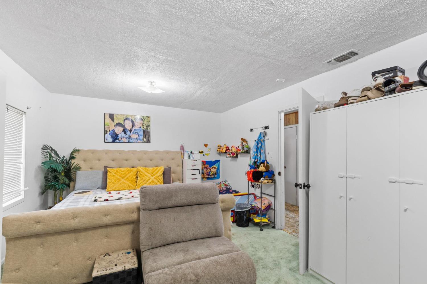 6944 Greenbay Road Arbuckle, CA 95912 - Photo 14 of 18 a living room with furniture and a flat screen tv
