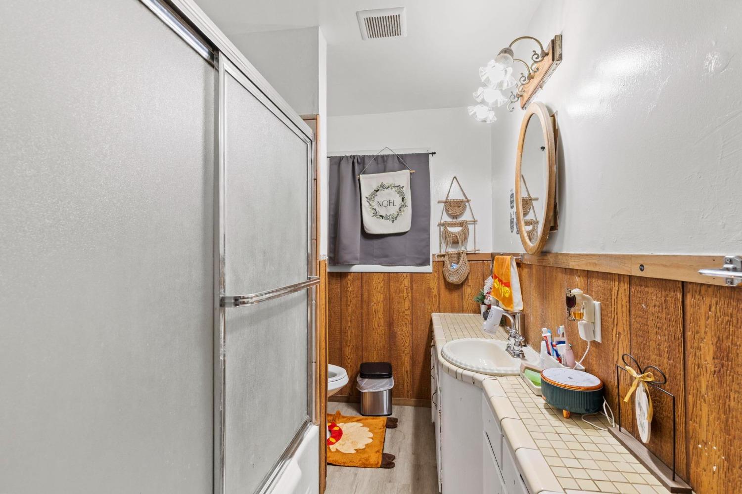 6944 Greenbay Road Arbuckle, CA 95912 - Photo 15 of 18 a bathroom with a sink mirror and toilet