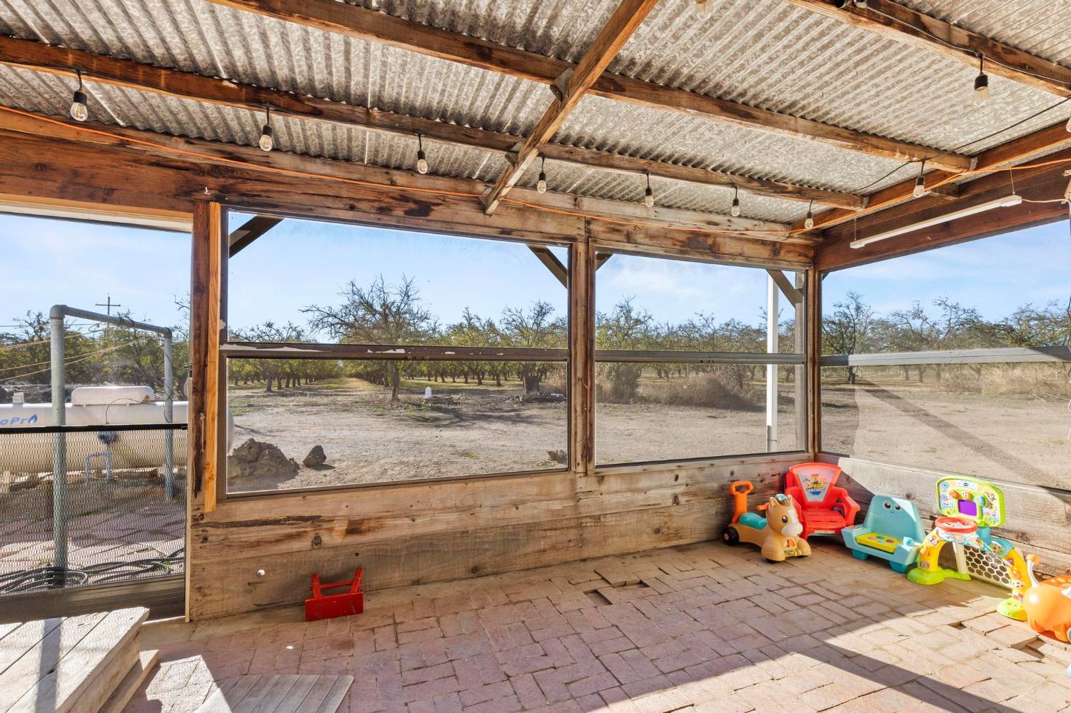 6944 Greenbay Road Arbuckle, CA 95912 - Photo 17 of 18 a view of sitting area with furniture and floor to ceiling window