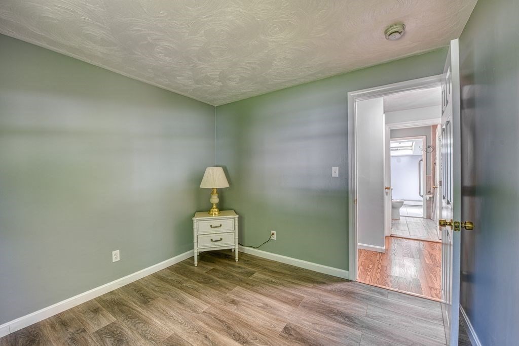 81 Errol Road Brockton, MA 02302 - Photo 10 of 31 a view of a room with wooden floor lounge chair and windows