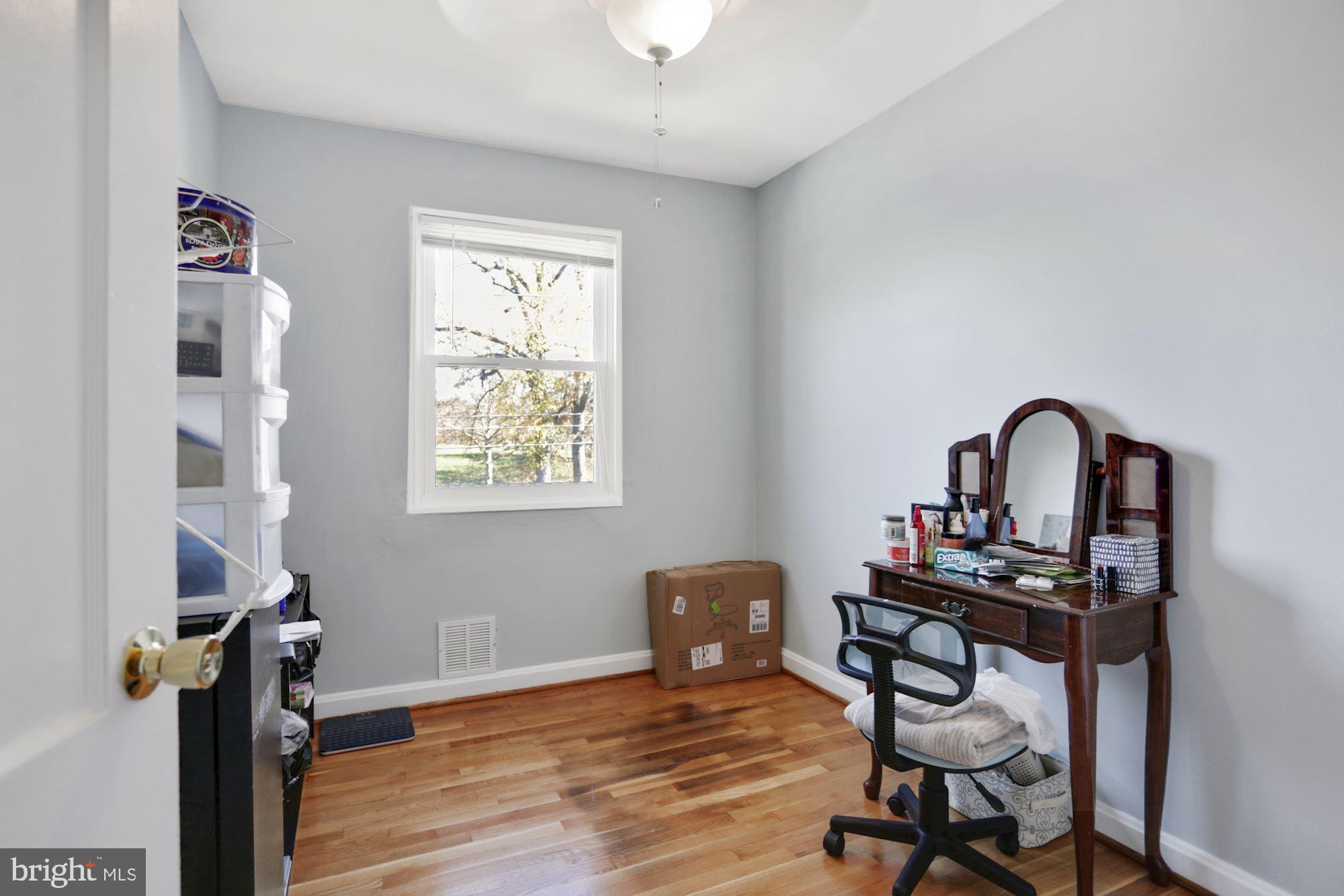 4910 Sargent Road Northeast Washington, DC 20017 - Photo 12 of 16 a view of a workspace with furniture and a window