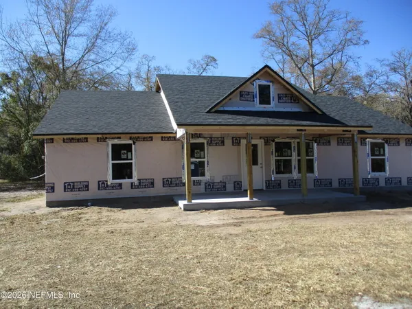 front view of a house with a yard