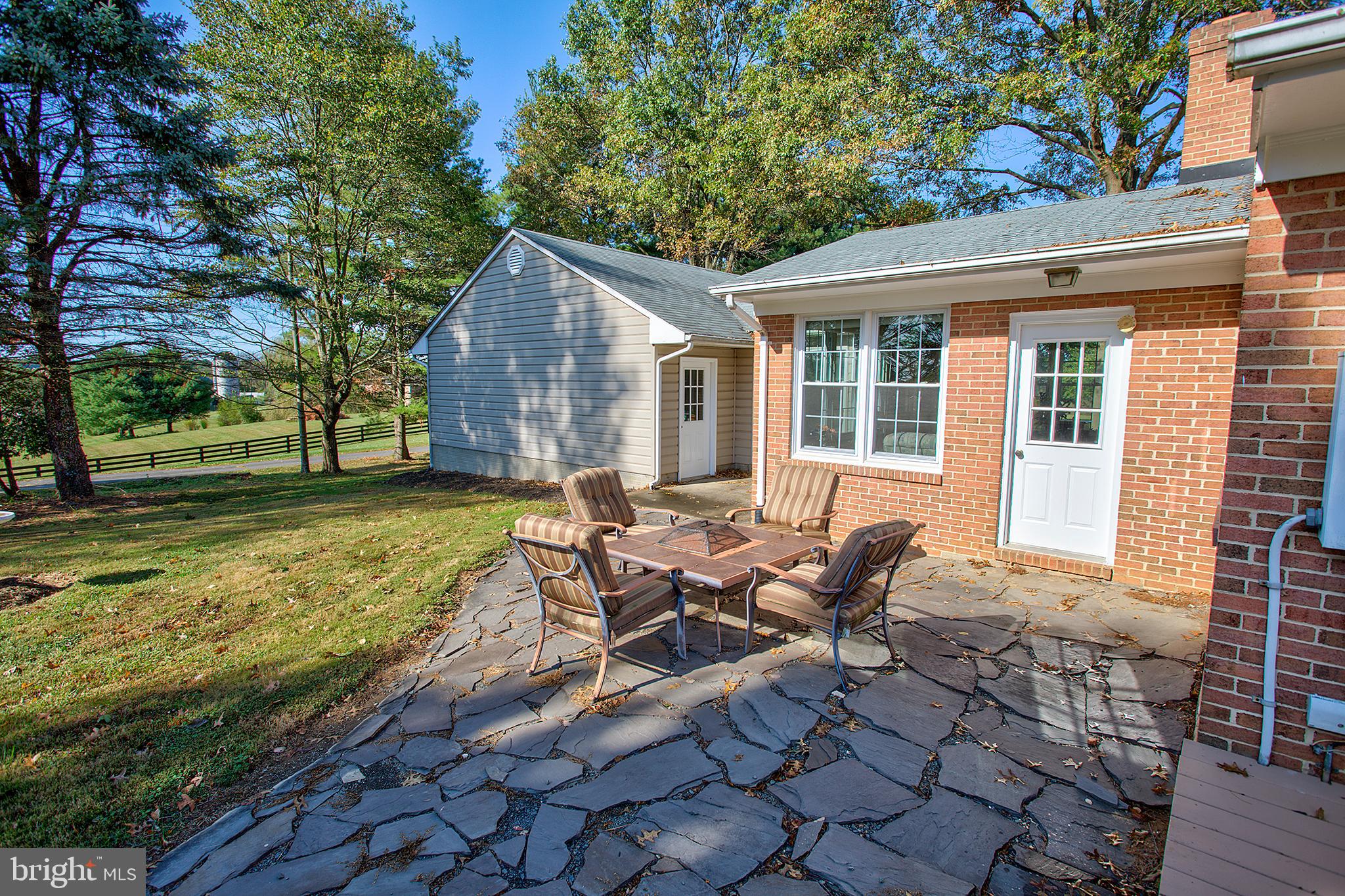 16962 Hamilton Station Road Paeonian Springs, VA 20129 - Photo 34 of 50 rear slate patio adjacent to deck