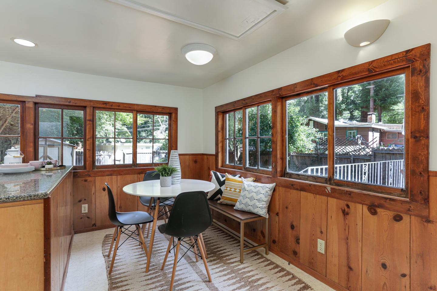 136 Pool Drive Boulder Creek, CA 95006 - Photo 14 of 25 a dining room with furniture a chandelier and wooden floor