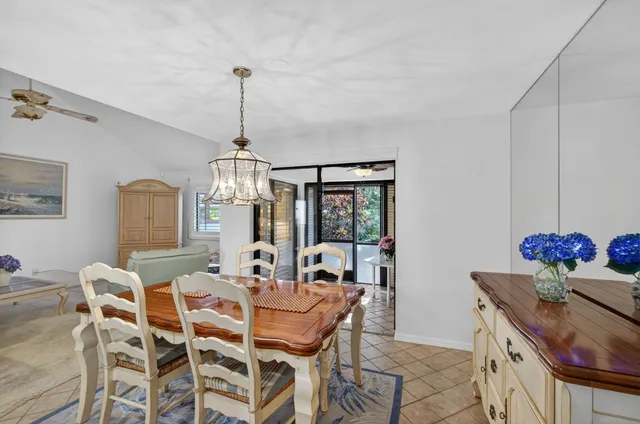 a living room with furniture a rug and a window