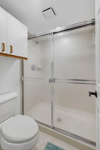 a bedroom with furniture and a flat screen tv