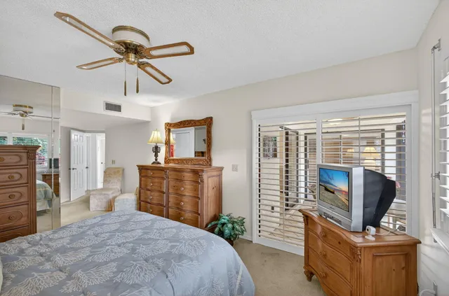 a room with furniture and a large window