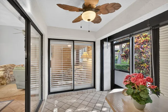 a front view of a house with a yard table and chairs