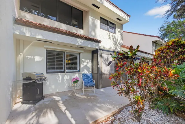 an aerial view of house with yard and swimming pool