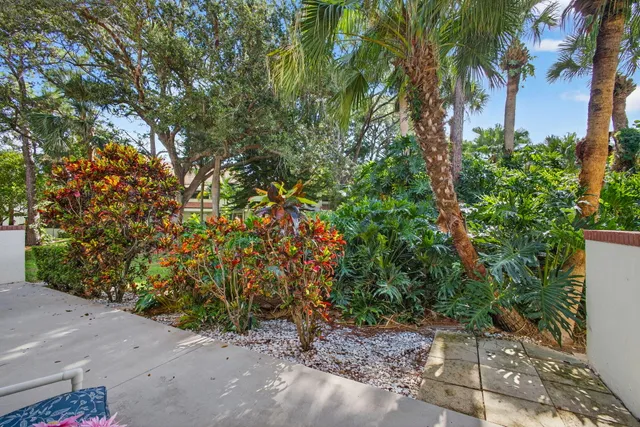 an aerial view of house with yard and ocean view