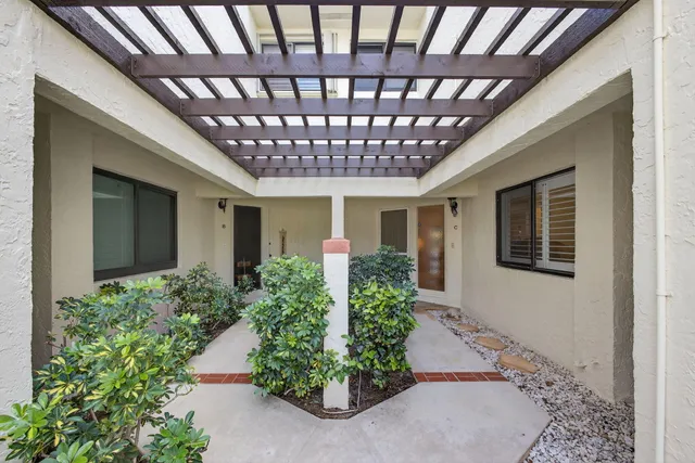 a view of a hallway with front door