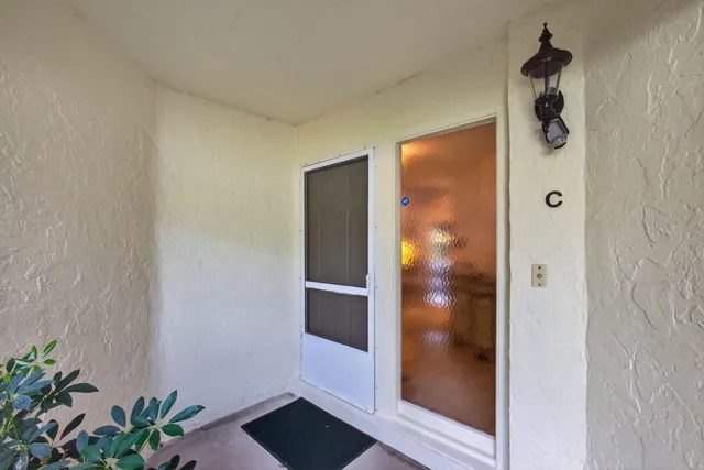 a kitchen with stainless steel appliances a refrigerator and a stove top oven
