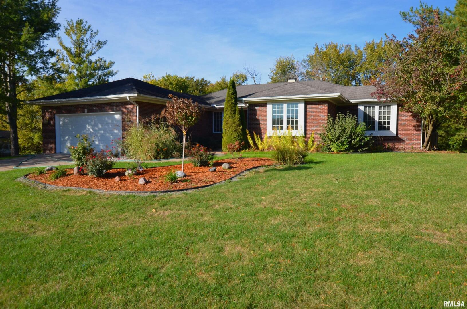 3 Chestnut Drive Blue Grass, IA 52726 - Photo 1 of 15 a view of a house with a yard patio and fire pit