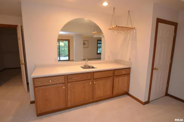 a spacious bathroom with a double vanity sink and a mirror