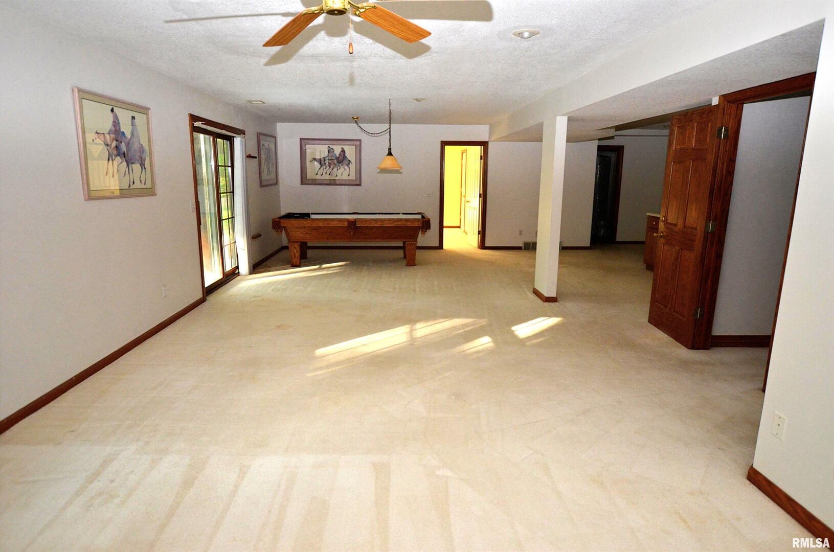 3 Chestnut Drive Blue Grass, IA 52726 - Photo 12 of 15 a view of a livingroom with furniture and window