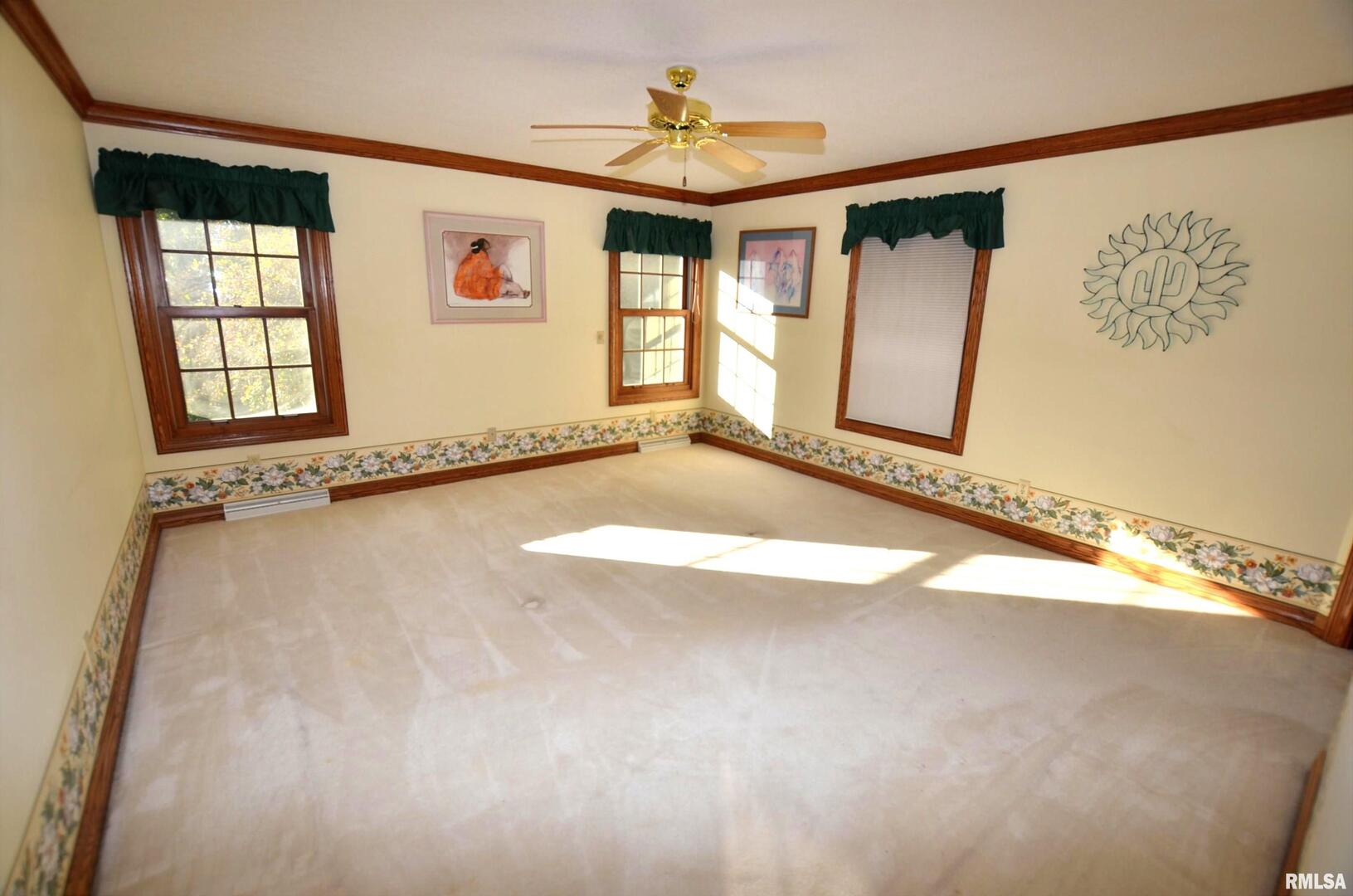 3 Chestnut Drive Blue Grass, IA 52726 - Photo 5 of 15 a view of an empty room with a window