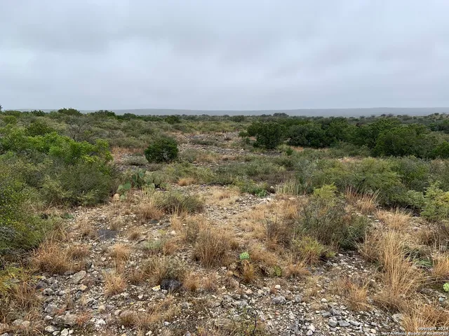 a view of a lake with green space