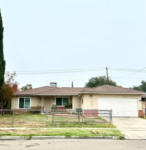 a front view of a house with lots of windows
