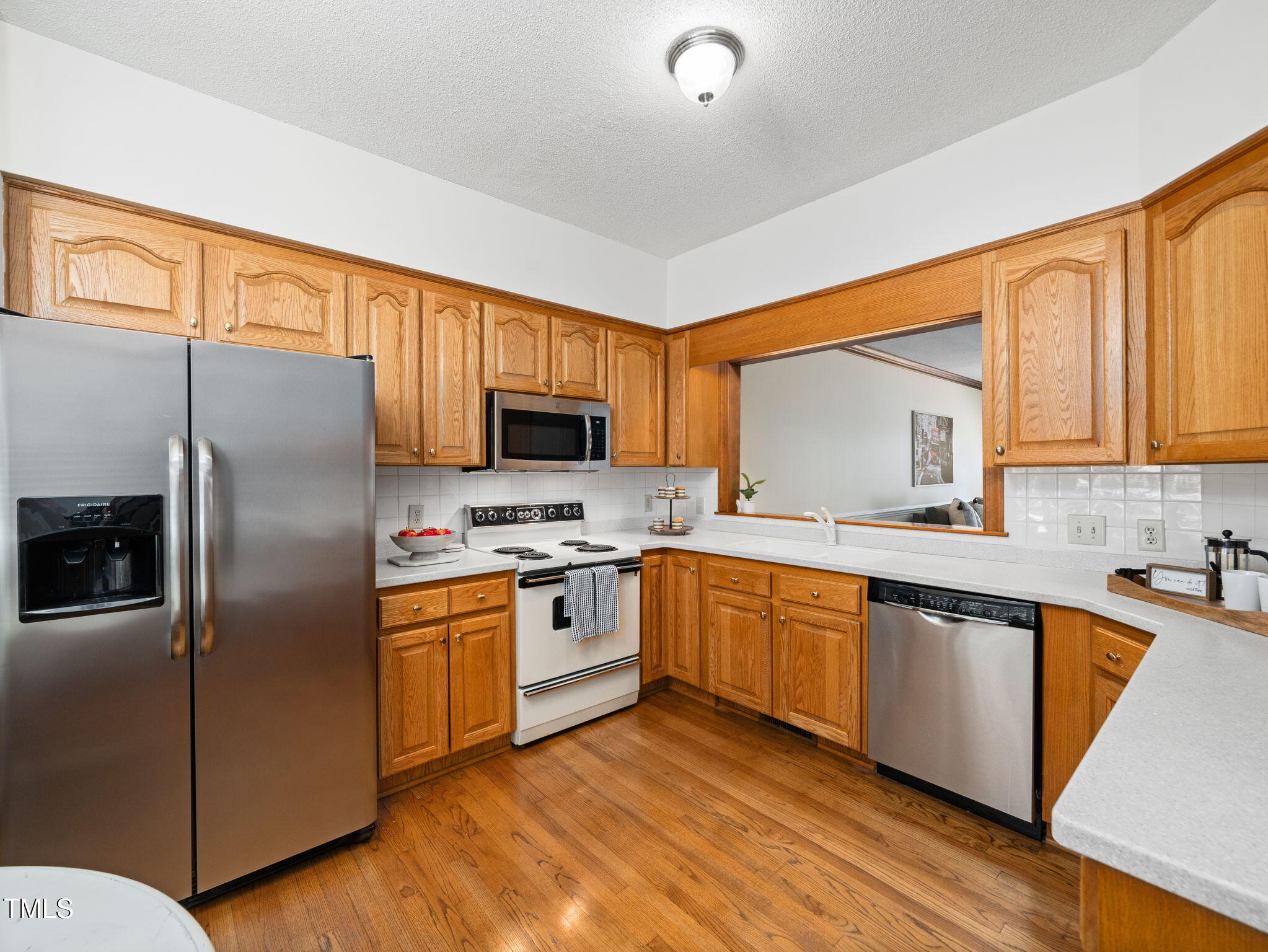 2610 Sawmill Road Raleigh, NC 27613 - Photo 5 of 25 Bright Kitchen with Beautiful Hardwoods