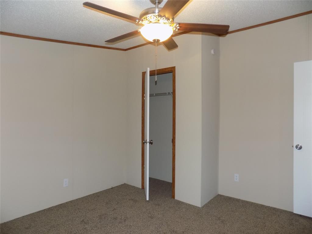 3450 Sarra Lane Springtown, TX 76082 - Photo 17 of 23 Carpeted secondary bedroom.