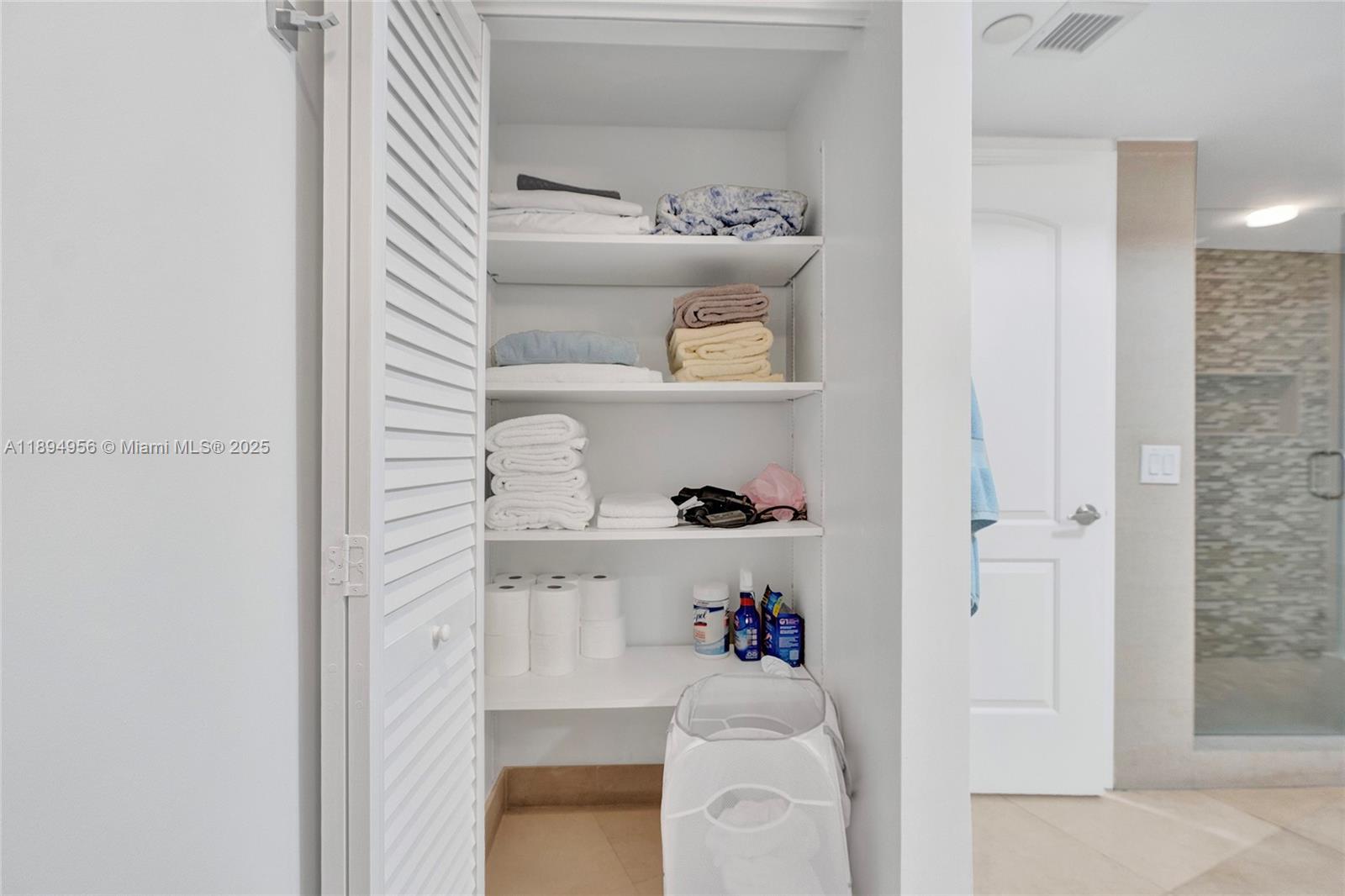 1000 East Island Boulevard, Unit 1403 Aventura, FL 33160 - Photo 52 of 99 Linen Closet
