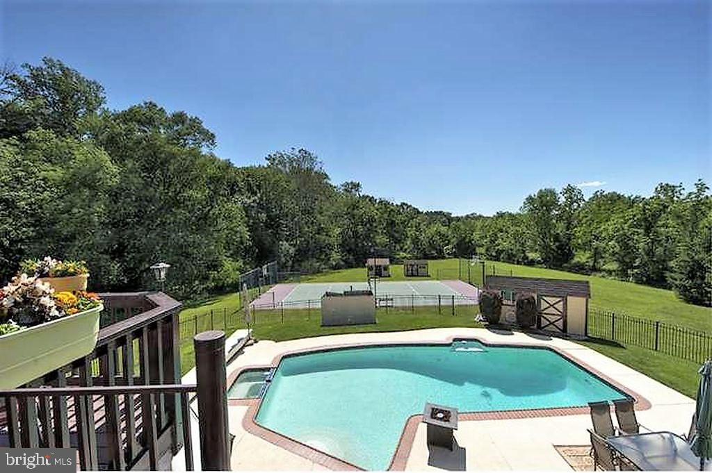 1075 Eagle Road Newtown, PA 18940 - Photo 4 of 53 View Of In Ground Pool From Main Suite's Balcony