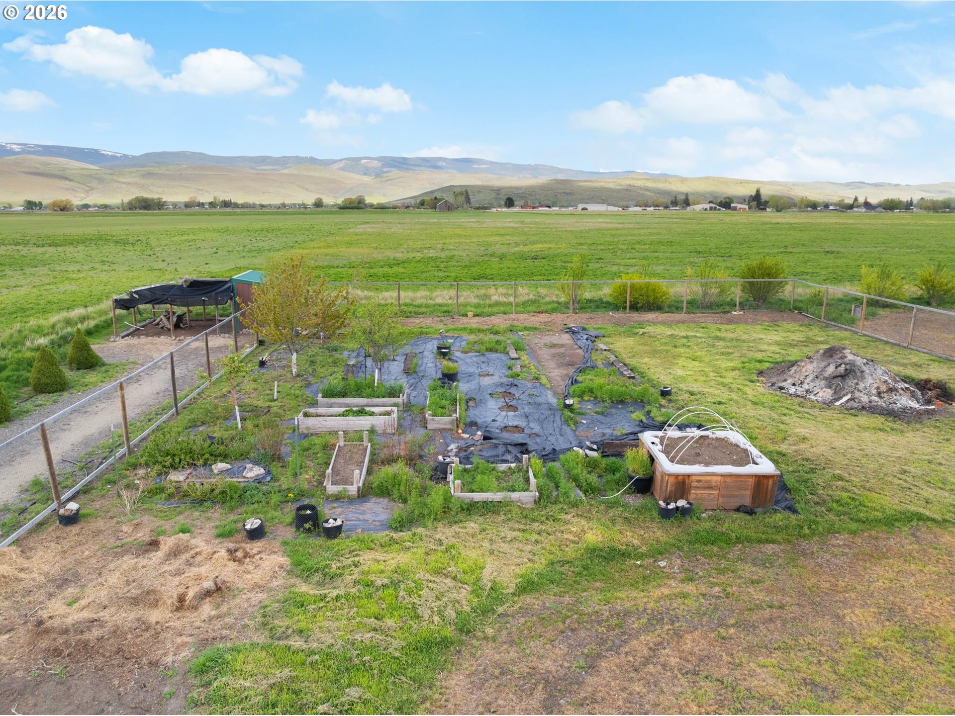 58015 Godley Road Union, OR 97883 - Photo 32 of 44 an aerial view of a house with garden space and ocean view
