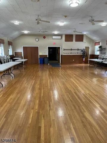 a big room with stainless steel appliances kitchen island a large island in the center