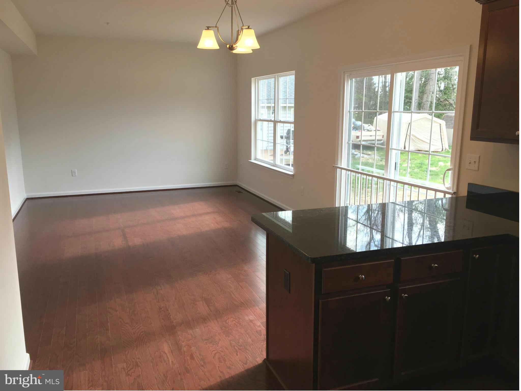 13213 Choptank Road Baltimore, MD 21220 - Photo 4 of 10 a view of an empty room with a window