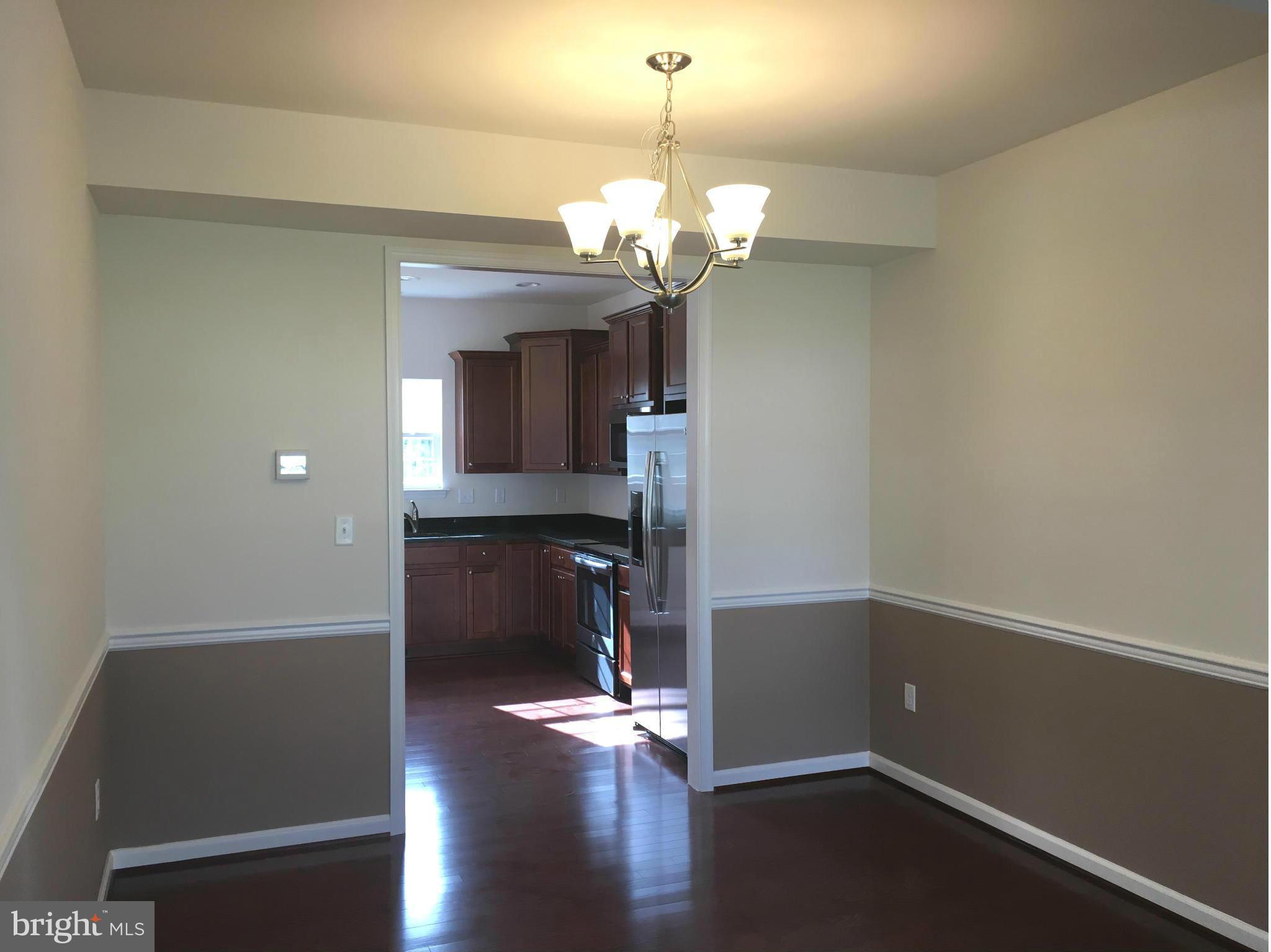 13213 Choptank Road Baltimore, MD 21220 - Photo 5 of 10 a view of a room with wooden floor
