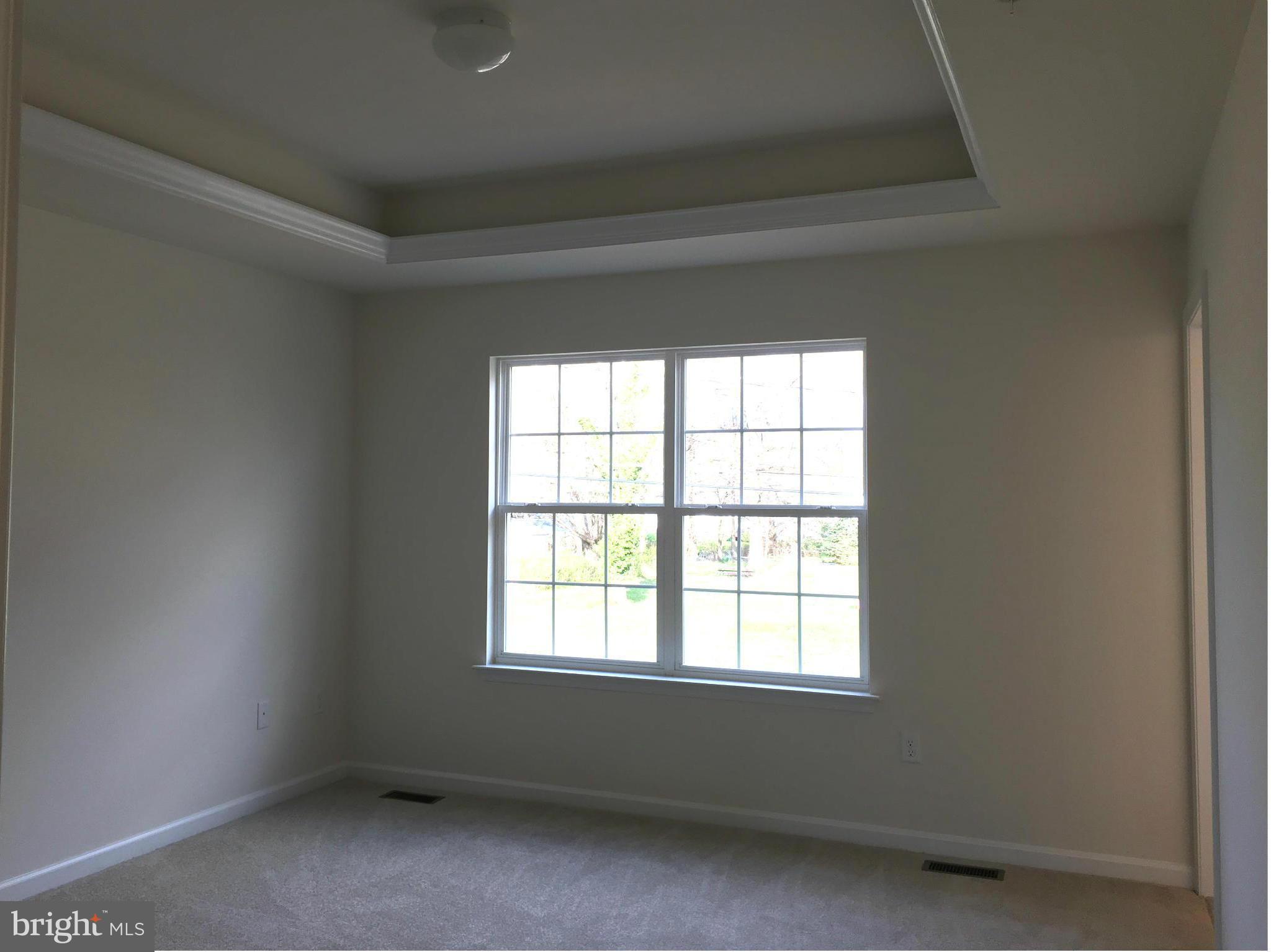 13213 Choptank Road Baltimore, MD 21220 - Photo 6 of 10 an empty room with a window