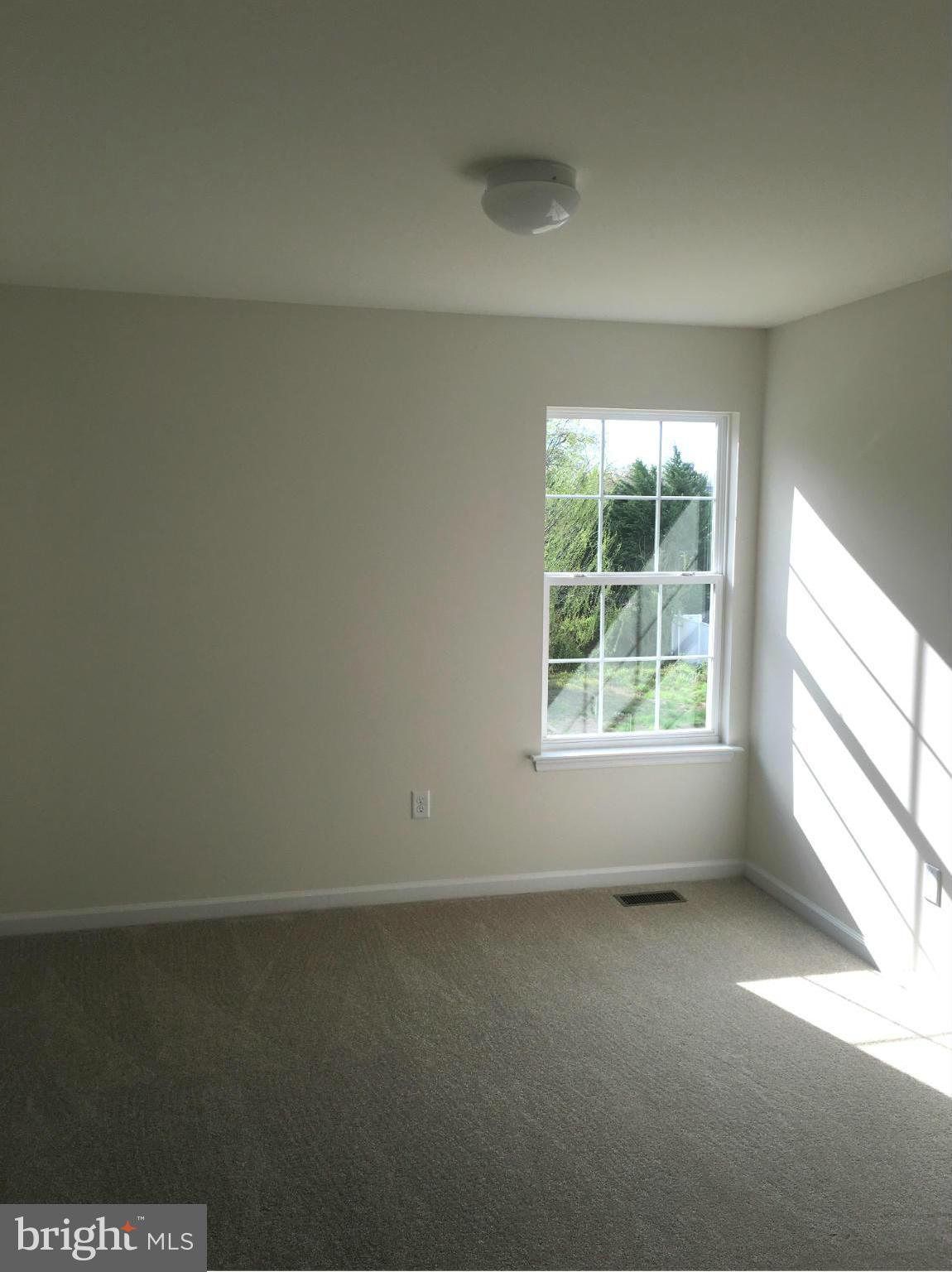 13213 Choptank Road Baltimore, MD 21220 - Photo 8 of 10 an empty room with a window