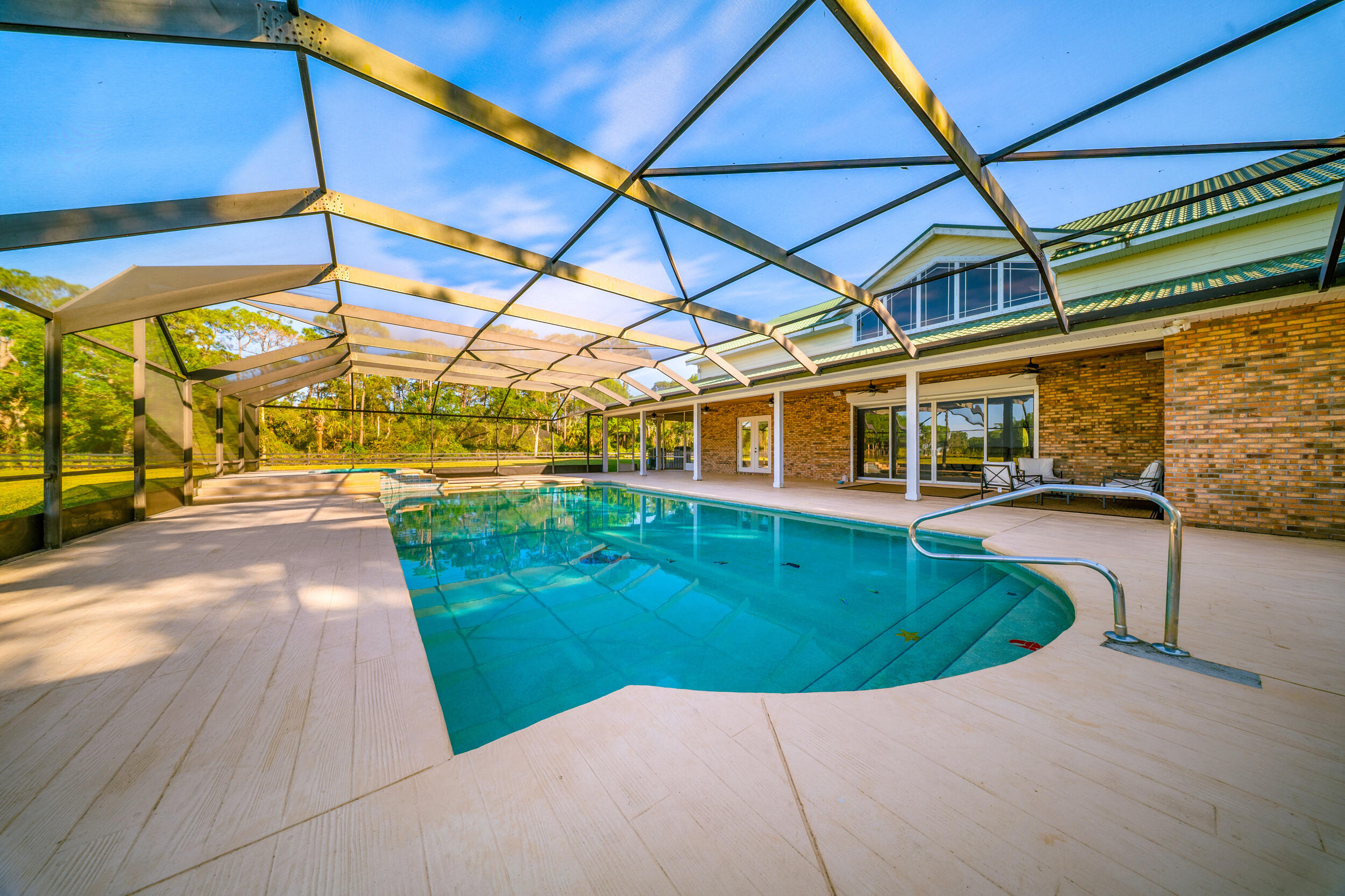 8686 Andrews Avenue Fort Pierce, FL 34945 - Photo 6 of 76 a view of a swimming pool with a patio