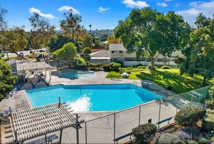 242 Village Green Road Encinitas, CA 92024 - Photo 1 of 16 a view of a swimming pool with a patio