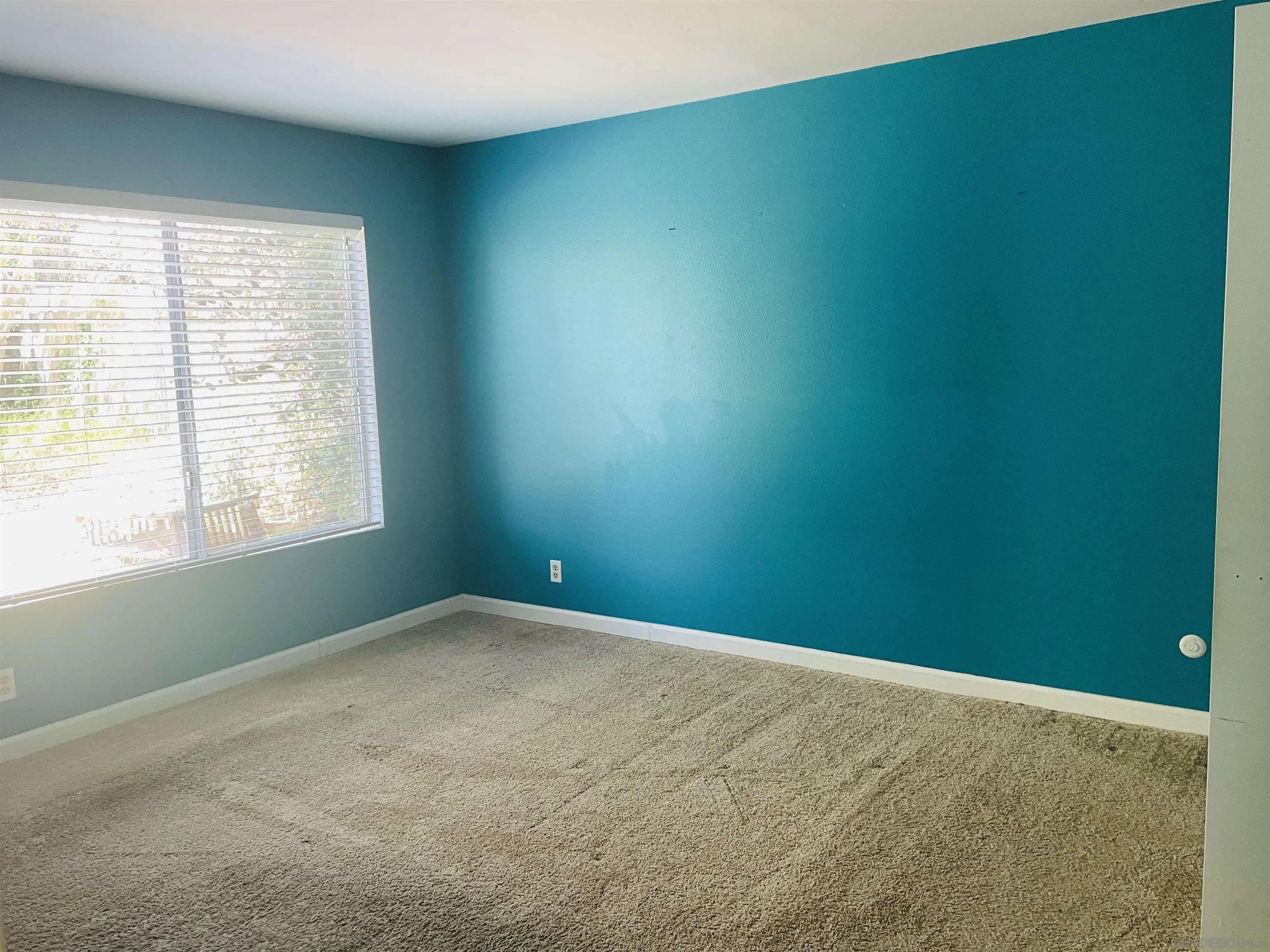 242 Village Green Road Encinitas, CA 92024 - Photo 11 of 16 an empty room with a window