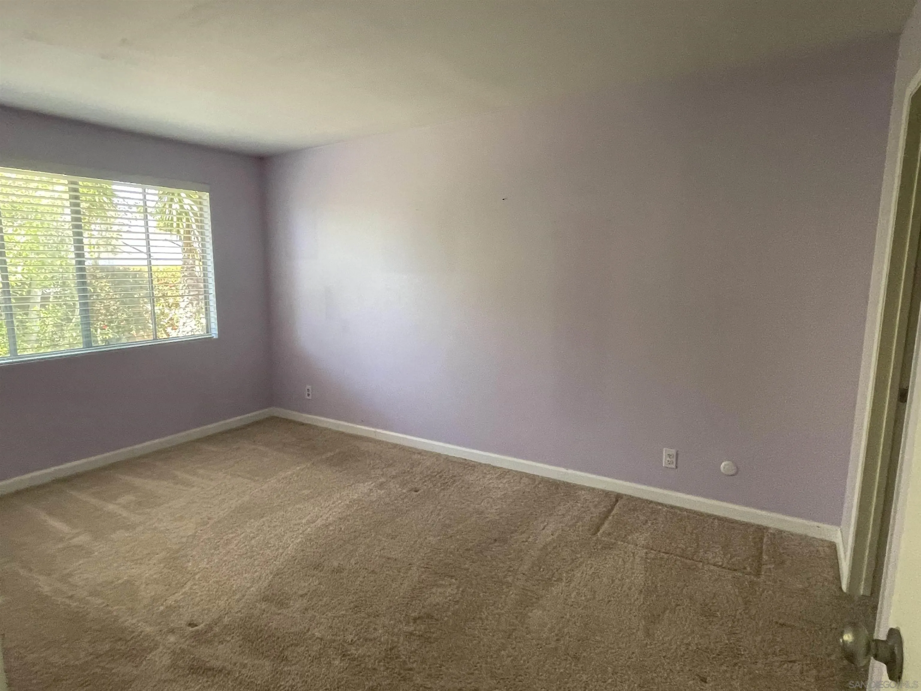 242 Village Green Road Encinitas, CA 92024 - Photo 6 of 16 an empty room with a window