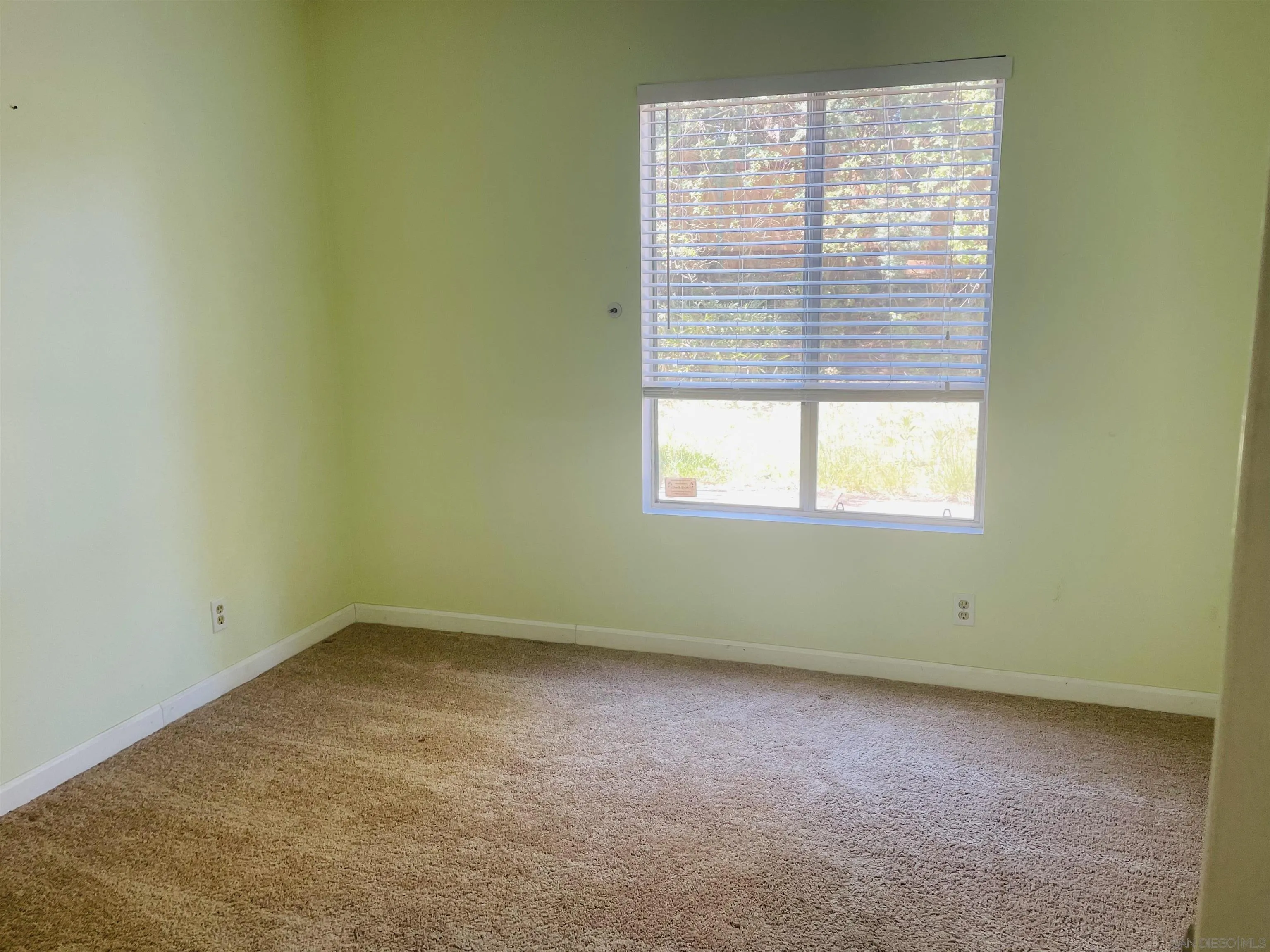 242 Village Green Road Encinitas, CA 92024 - Photo 10 of 16 an empty room with a window