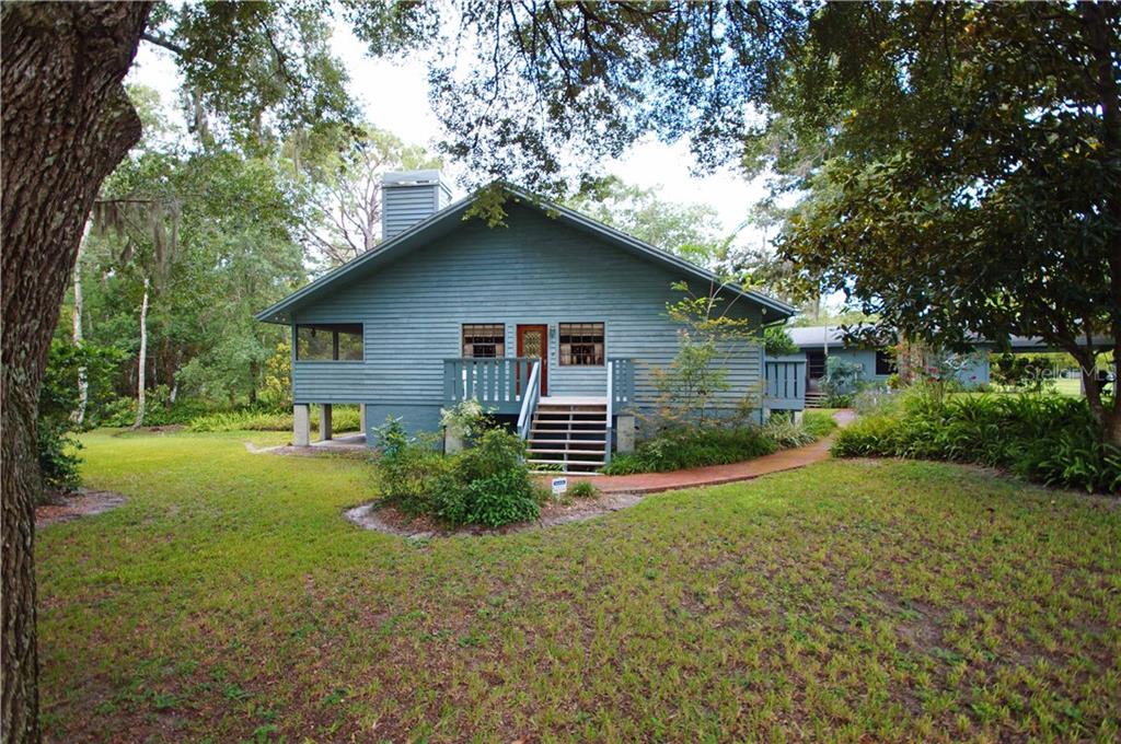 2630 Hunt Road Tarpon Springs, FL 34688 - Photo 1 of 1 Brick path leads to the front door