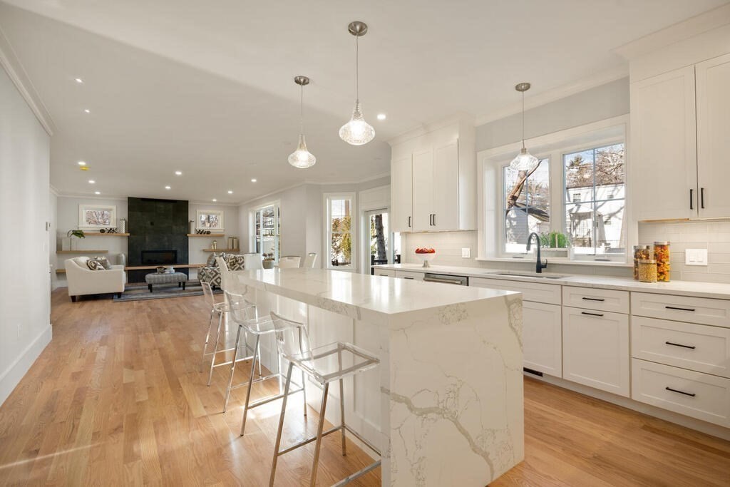 40 Bridge Street Lexington, MA 02421 - Photo 15 of 42 a large white kitchen with lots of counter space and a sink