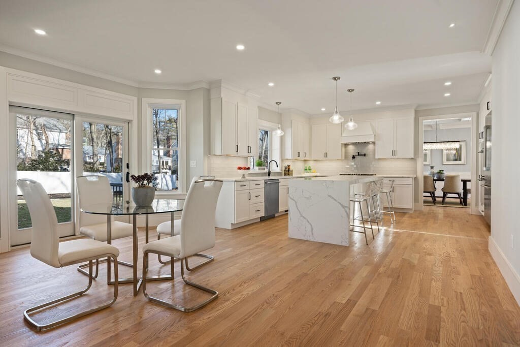 40 Bridge Street Lexington, MA 02421 - Photo 19 of 42 a dining hall with stainless steel appliances granite countertop a dining table chairs and view kitchen