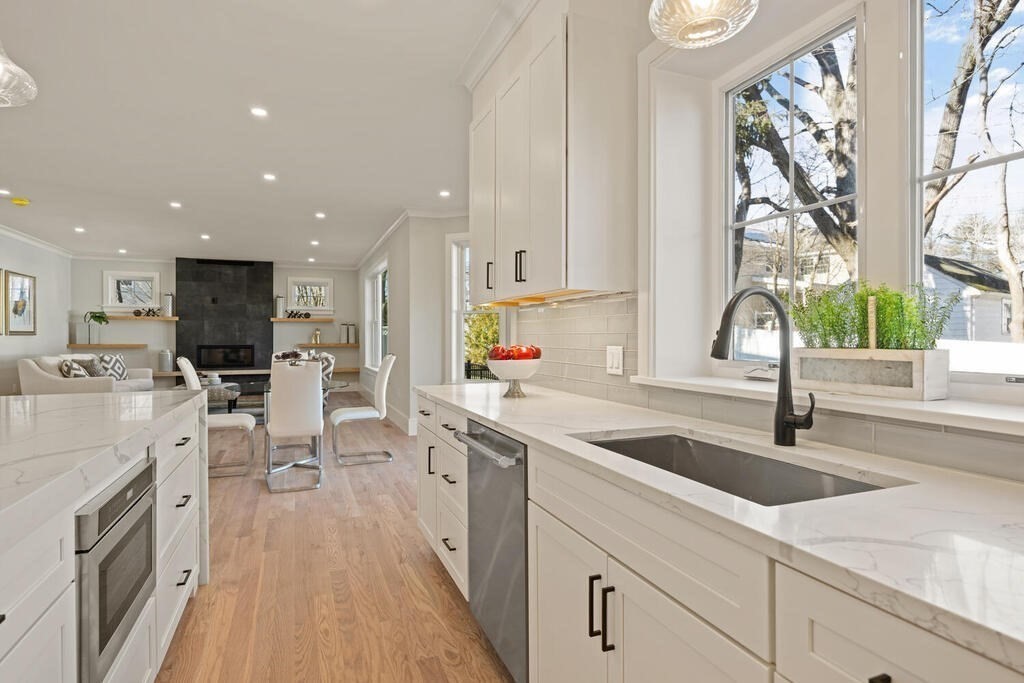 40 Bridge Street Lexington, MA 02421 - Photo 20 of 42 a kitchen with white cabinets appliances and sink