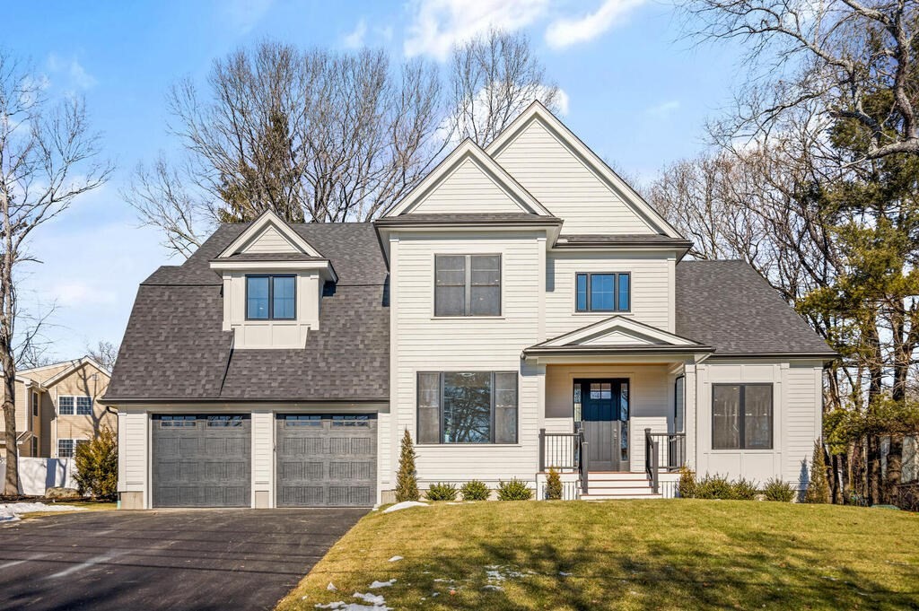 40 Bridge Street Lexington, MA 02421 - Photo 2 of 42 a front view of a house with garden