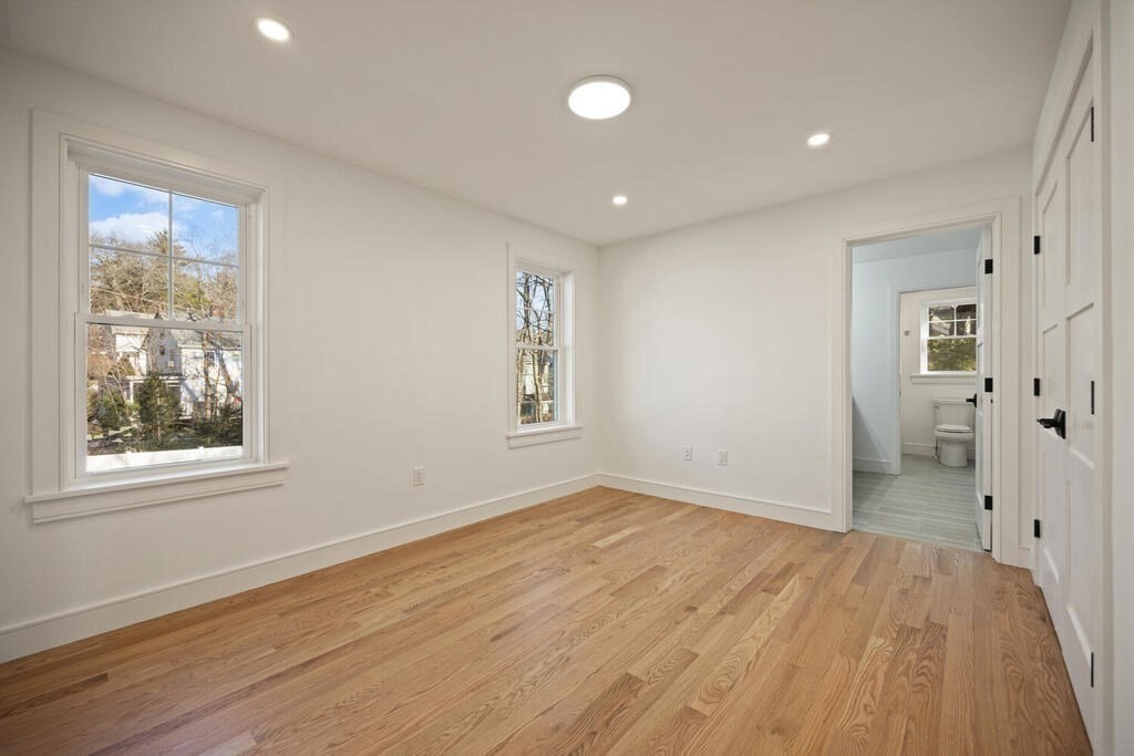 40 Bridge Street Lexington, MA 02421 - Photo 23 of 42 wooden floor in an empty room with a window
