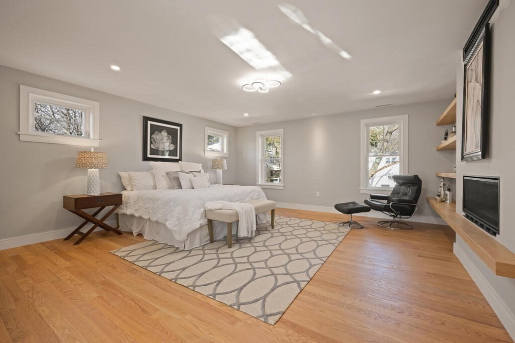 40 Bridge Street Lexington, MA 02421 - Photo 24 of 42 a bedroom with furniture and a fireplace