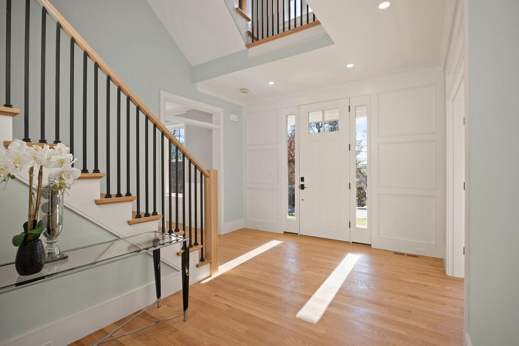 40 Bridge Street Lexington, MA 02421 - Photo 3 of 42 a view of a hallway with entryway and wooden floor