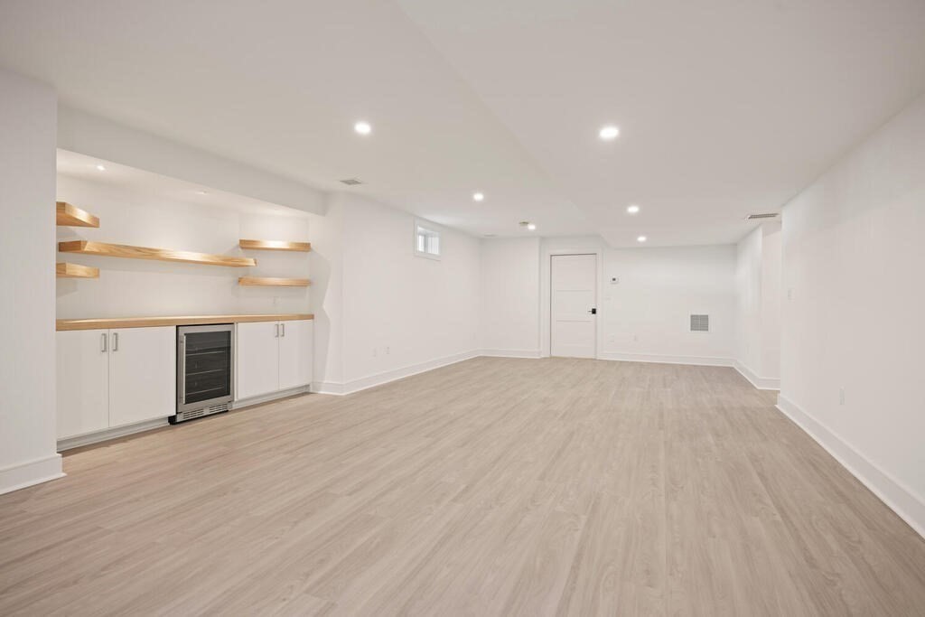 40 Bridge Street Lexington, MA 02421 - Photo 32 of 42 an empty room with wooden floor