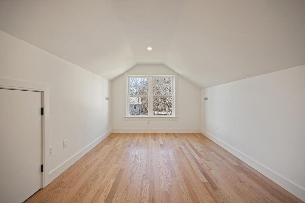 40 Bridge Street Lexington, MA 02421 - Photo 35 of 42 a view of an empty room with wooden floor and a window