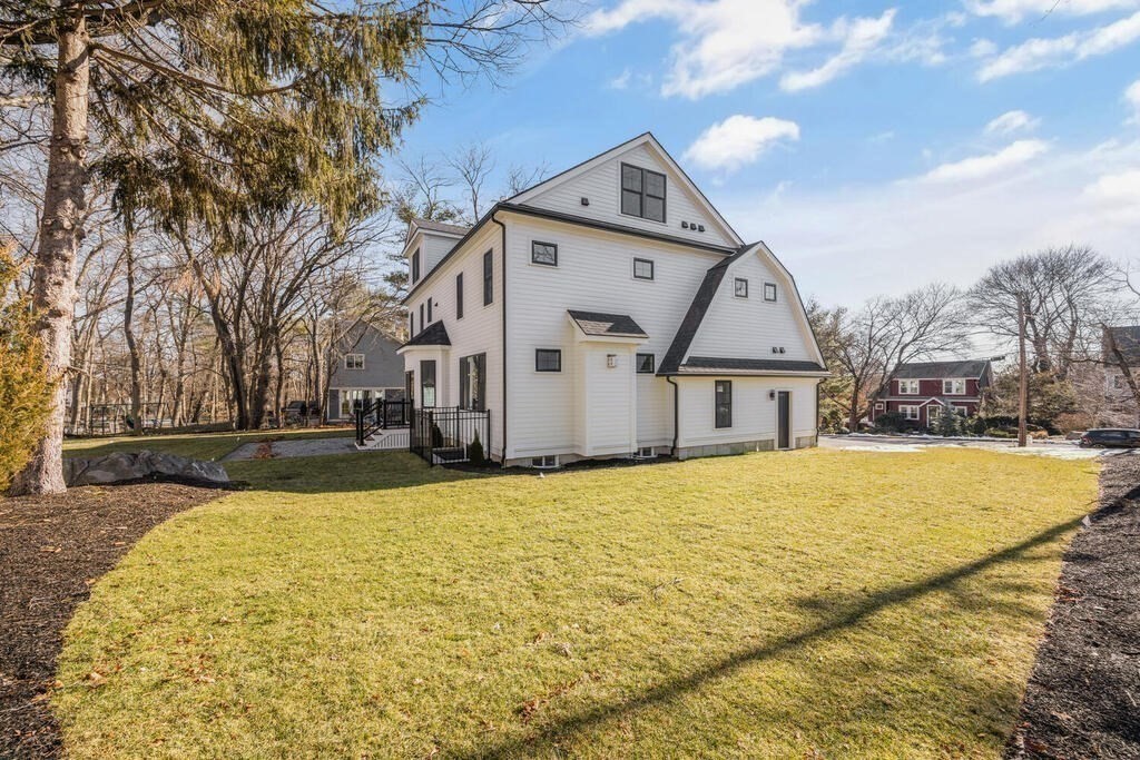 40 Bridge Street Lexington, MA 02421 - Photo 37 of 42 a front view of house with yard and trees in the background