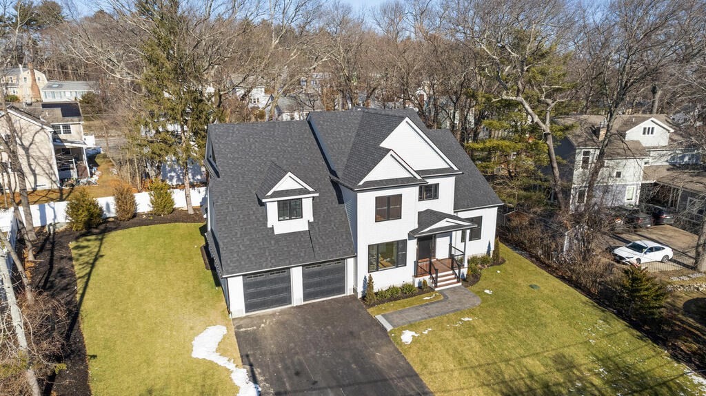 40 Bridge Street Lexington, MA 02421 - Photo 39 of 42 a front view of a house with a yard